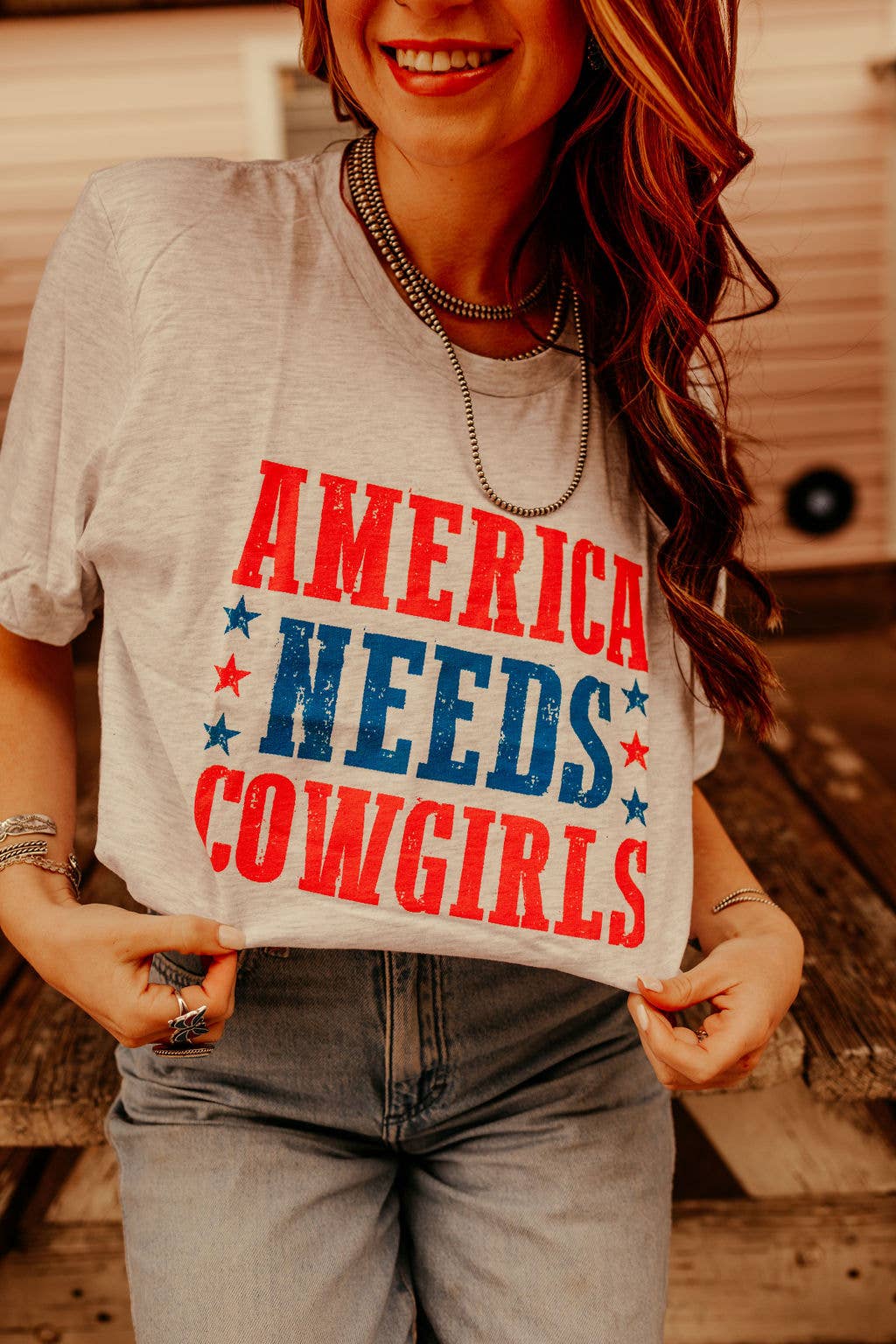 America Needs Cowgirls Graphic Tee